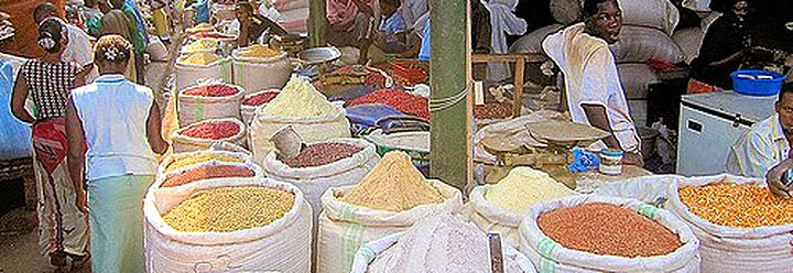 Sacks of grain in an aisle of Owino Market, also known as St. Balikuddembe Market, Kampala, Uganda