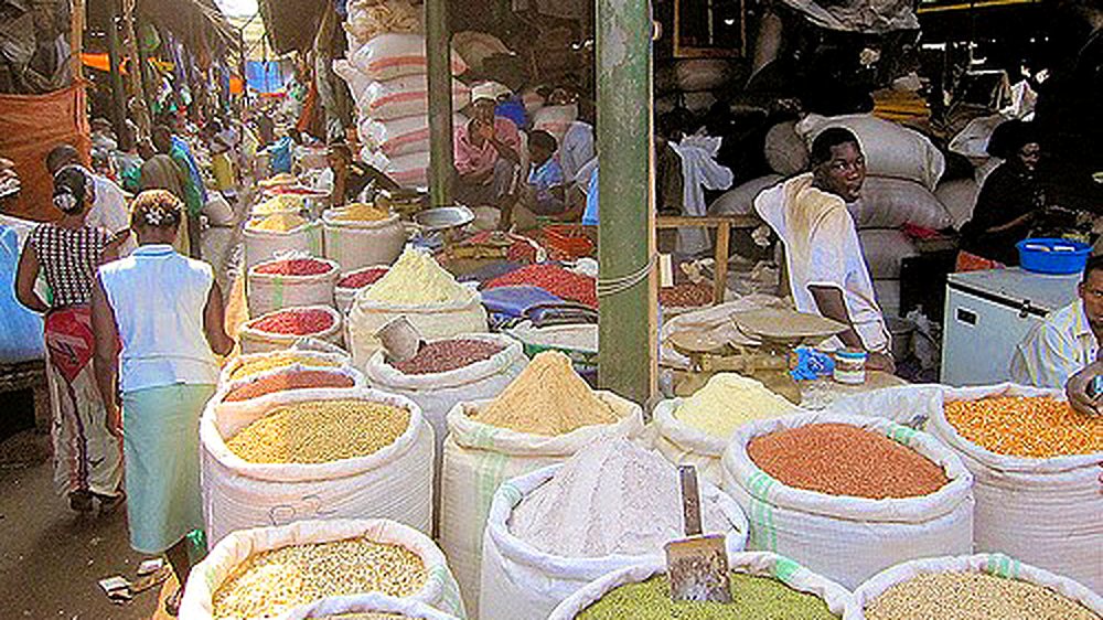 Sacks of grain in an aisle of Owino Market, also known as St. Balikuddembe Market, Kampala, Uganda